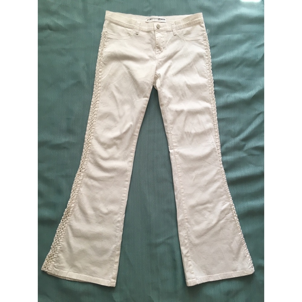 White stretch flared jeans.